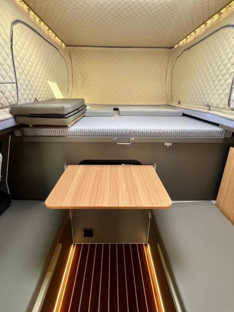 Grizzly Pod camper interior with table.
