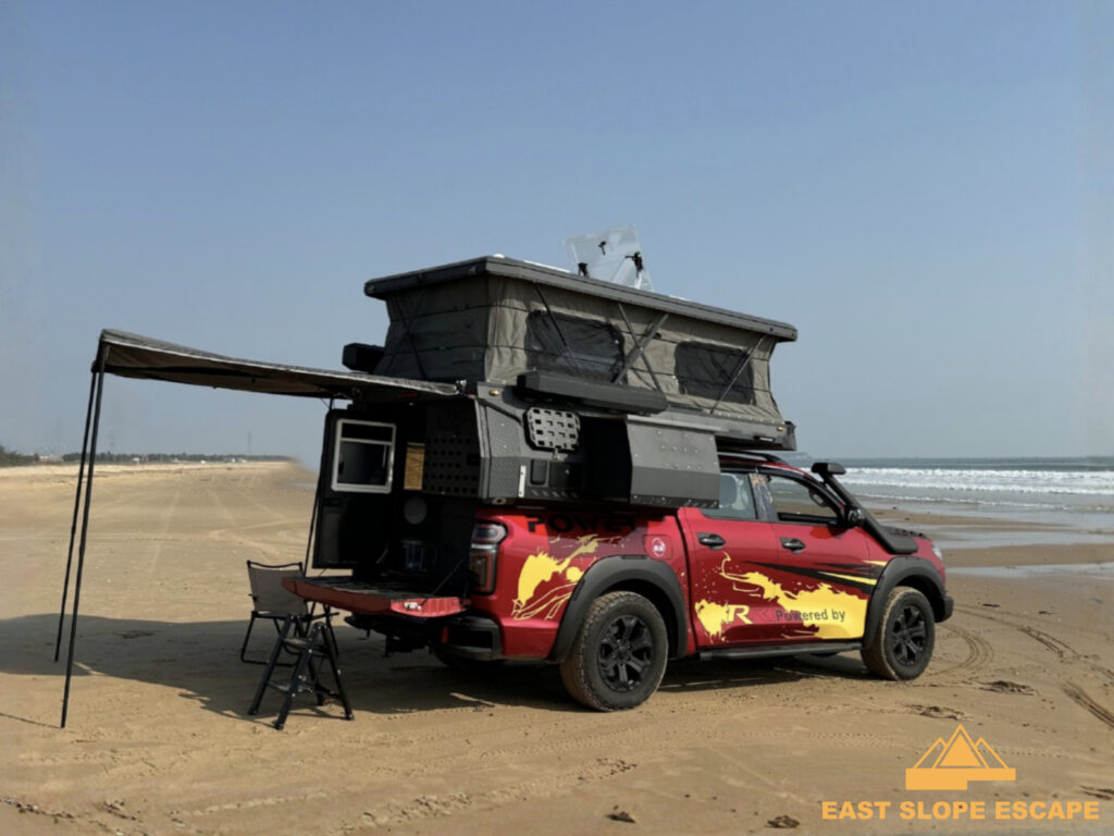 Ground Pod camper from side, on the beach