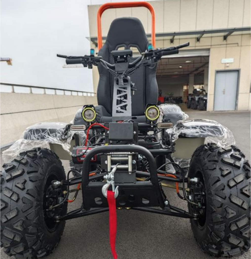 The Grizzly Ground Pounder, an ATV shown from the front. A red strap is attached to the winch in front.