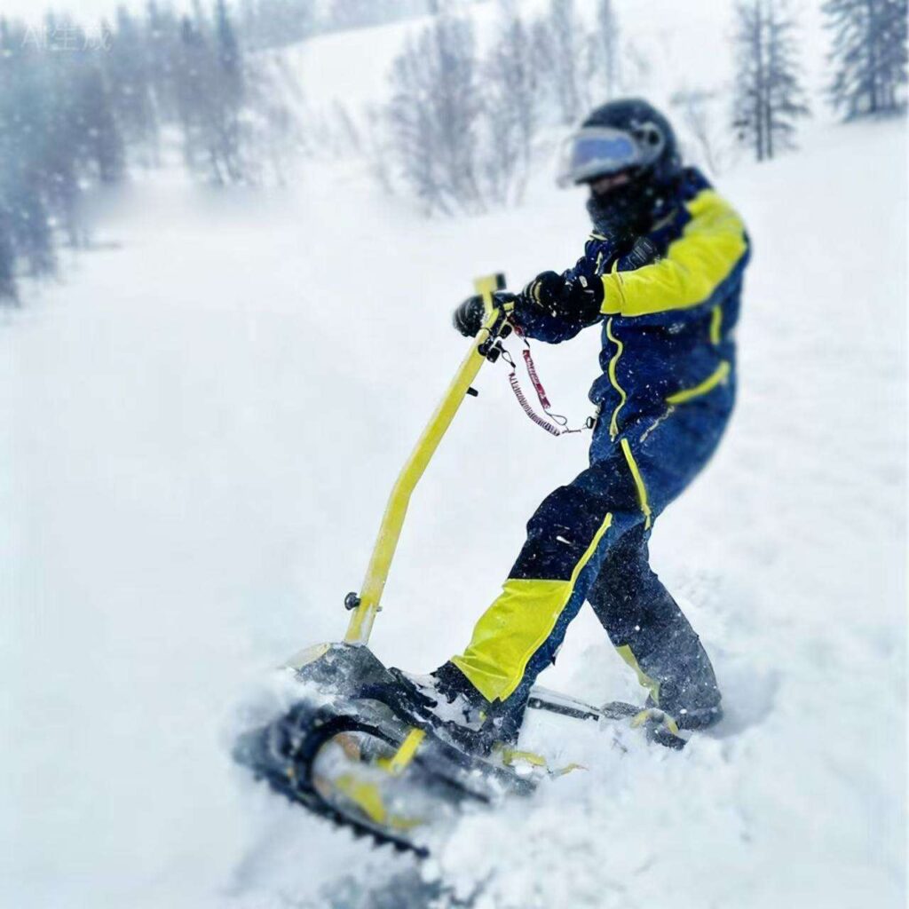 A rider in a snowsuit riding a standing snowmobile.