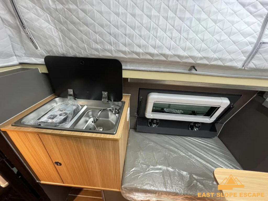 Sink with foldable tap